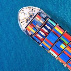Aerial view of container cargo ship in sea.